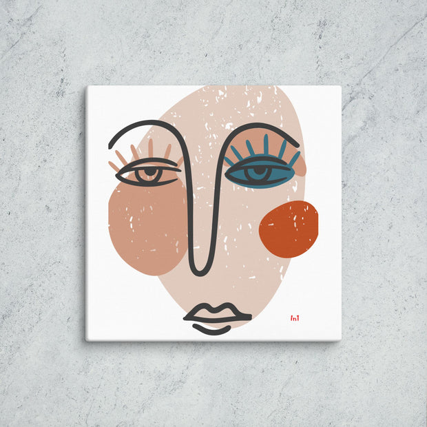 Abstract art print of a face on a textured wall