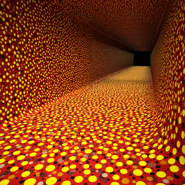 Tunnel with orange and yellow polka dot pattern on walls and ceiling