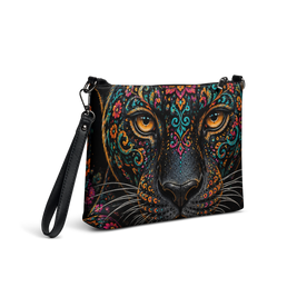 A black crossbody bag featuring a highly detailed, colorful graphic print of a leopard face with ornate mandala patterns and bright orange eyes.