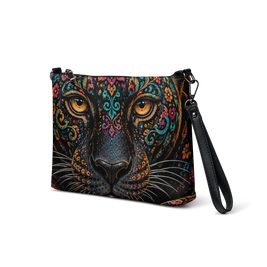 A black crossbody bag featuring a highly detailed, colorful graphic print of a leopard face with ornate mandala patterns and bright orange eyes, shown on a plain white background.