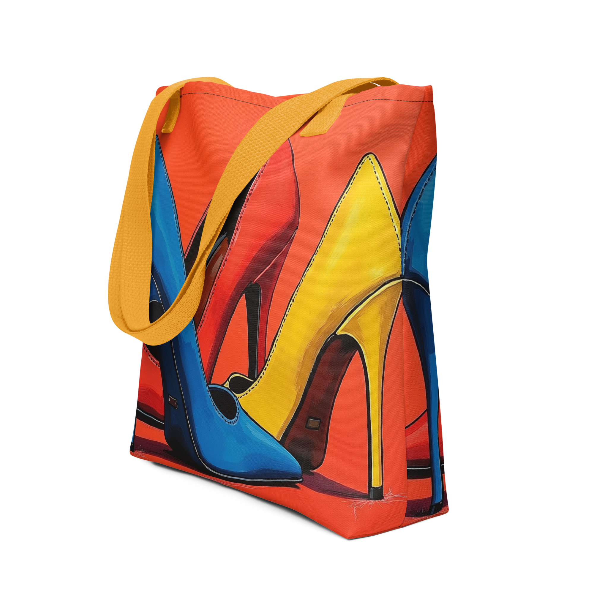 A tote bag with a vibrant graphic print of high-heeled shoes in blue, yellow, and red, featuring mustard yellow shoulder straps, shown on a plain white background.