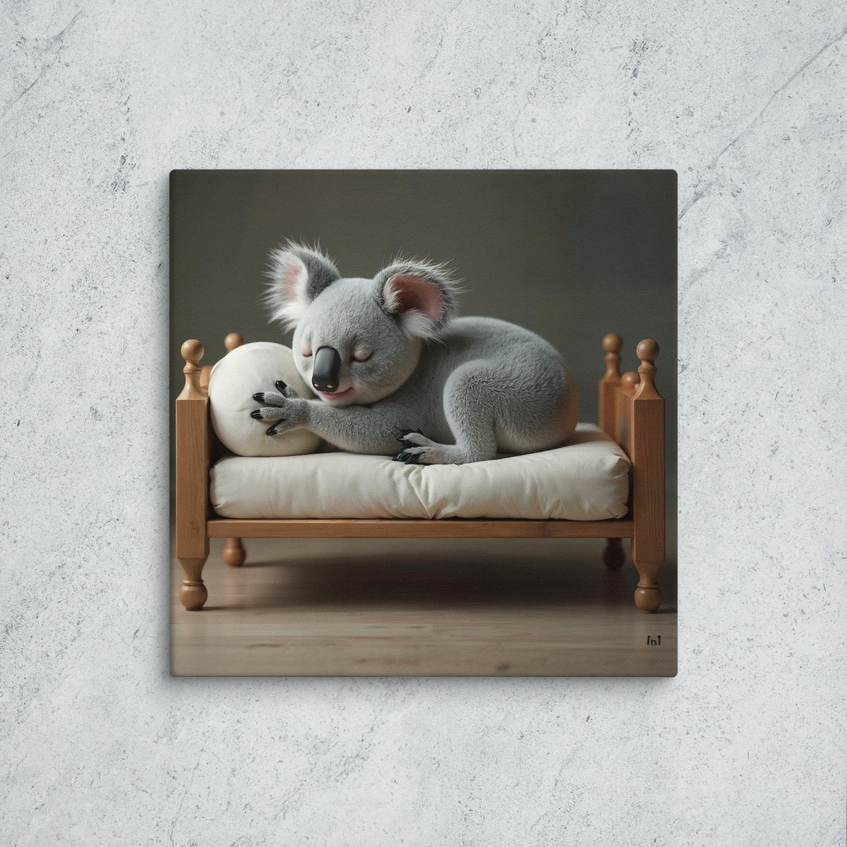 Koala on a small wooden bed with a white pillow against a gray background