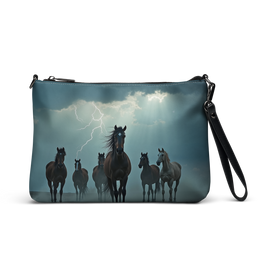 A zippered wristlet clutch with a printed design of a herd of horses under a stormy sky with lightning, shown on a plain white background.